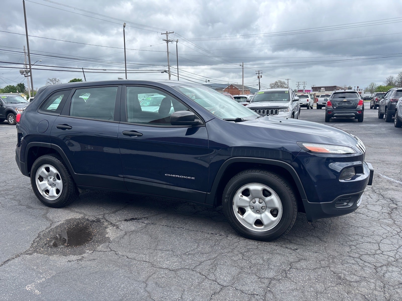 2016 Jeep Cherokee Sport in Blue — front three-quarter view