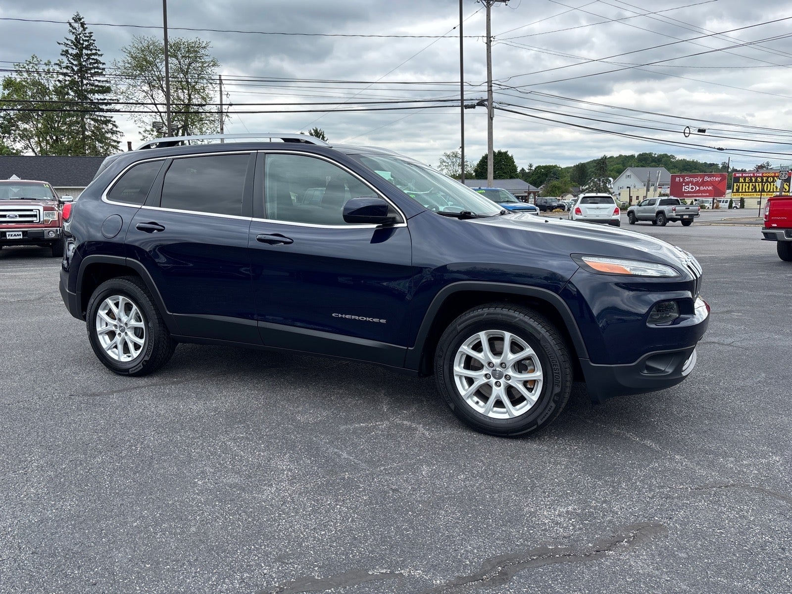 2016 Jeep Cherokee Latitude in Blue — front three-quarter view