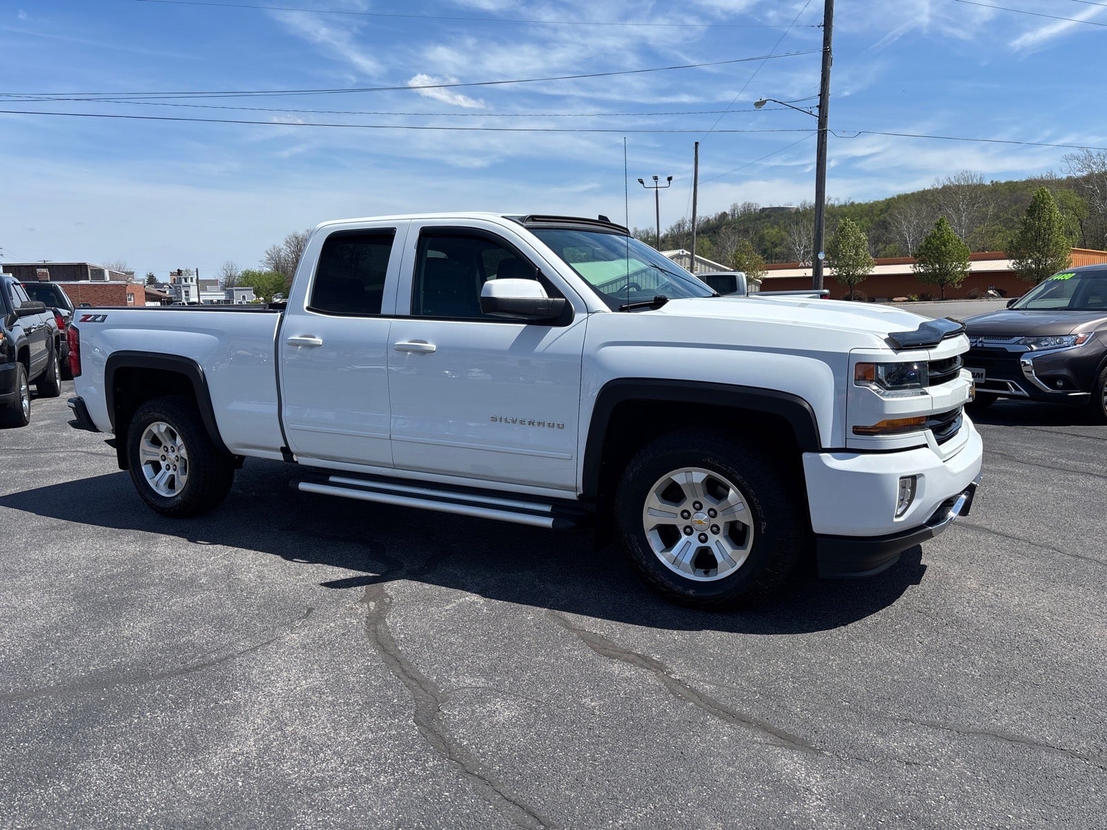 2018 Chevrolet Silverado 1500 LT in Summit White — front three-quarter view