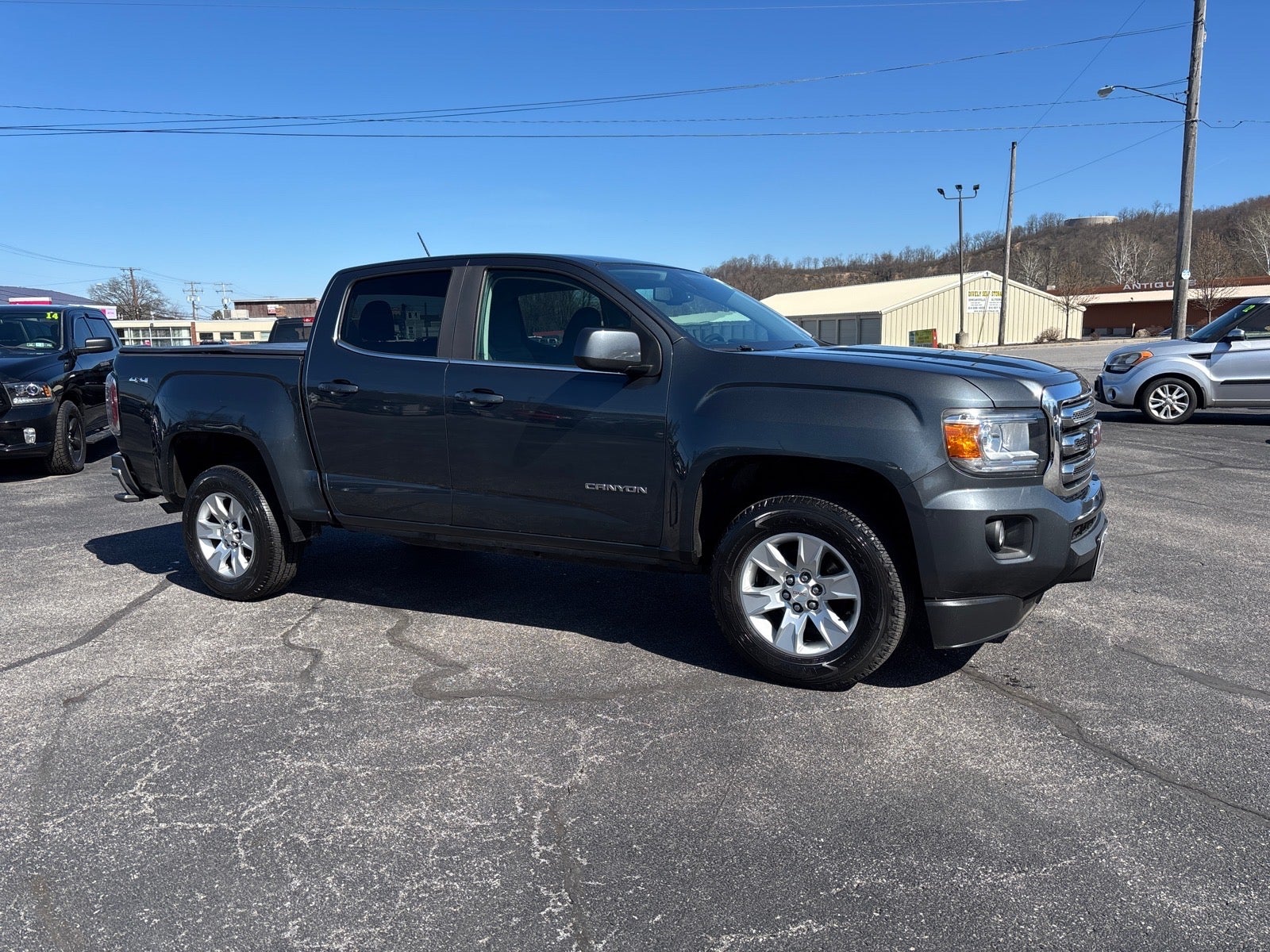 2017 GMC Canyon 4WD SLE in Cyber Gray Metallic — front three-quarter view