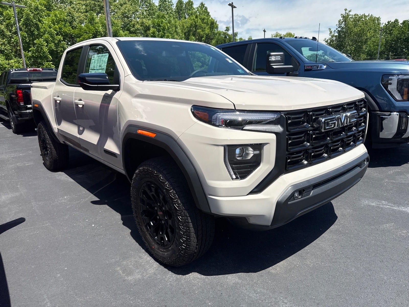 2026 GMC Canyon Elevation in Coastal Dune — front three-quarter view