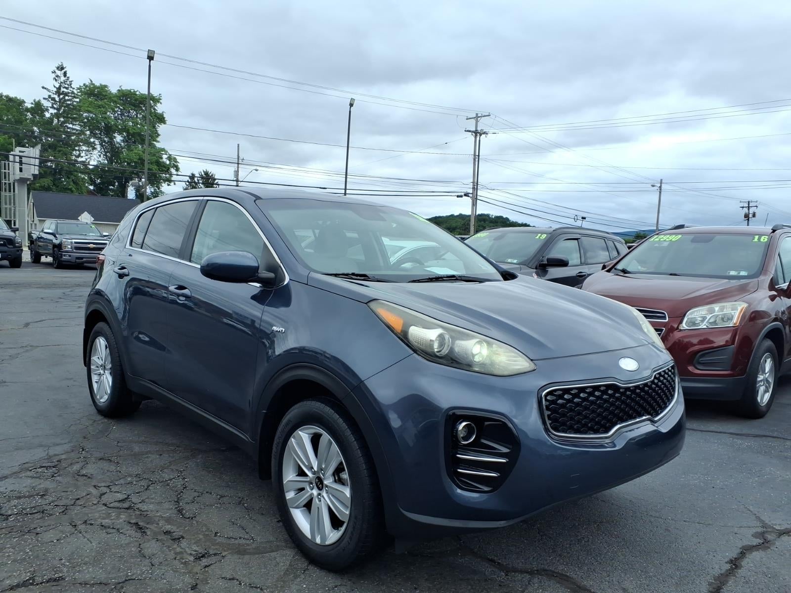 2018 Kia Sportage LX in Blue — front three-quarter view